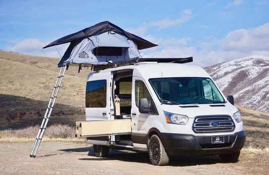 Hutch Roof Top Tent ona van in the snow capped mountains